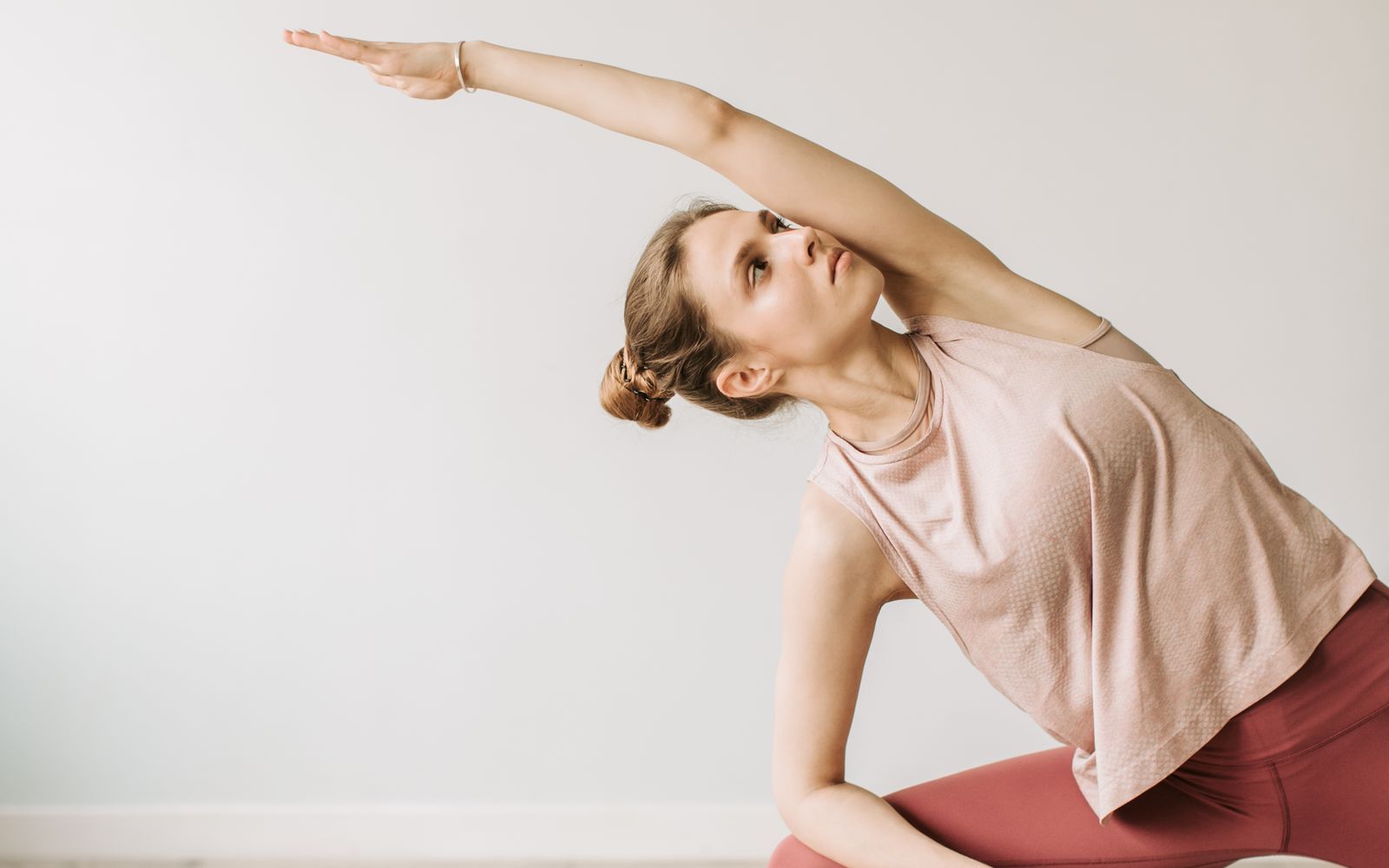 Person practising movement and mobility in a bright, open space