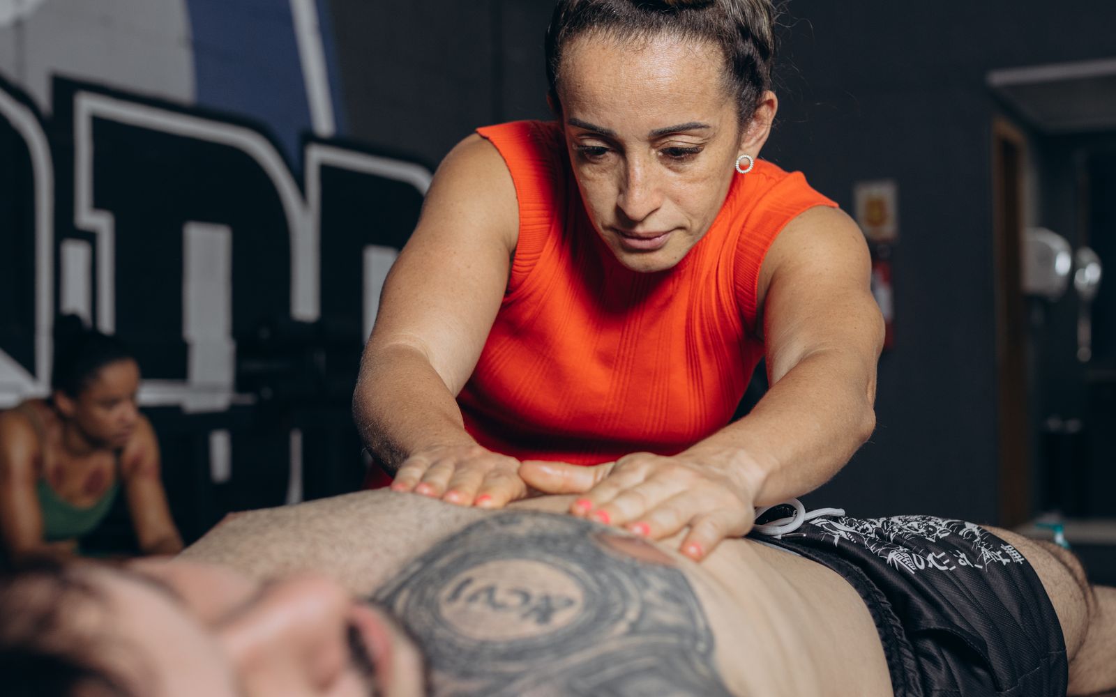 Coach discussing exercise recovery and restoration